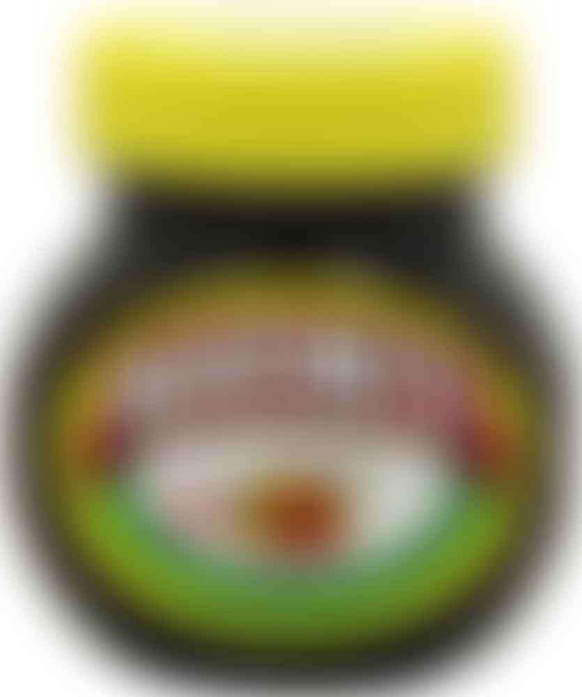 A jar of Marmite spread on a white background