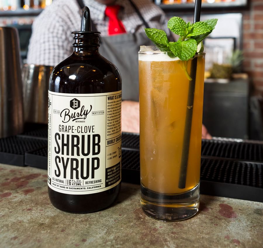 Assortment of artisanal soda and craft beer bottles