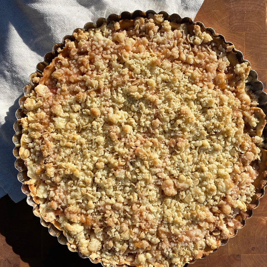 Collage of fresh rhubarb, blooming elderflower, and Swiss cheese