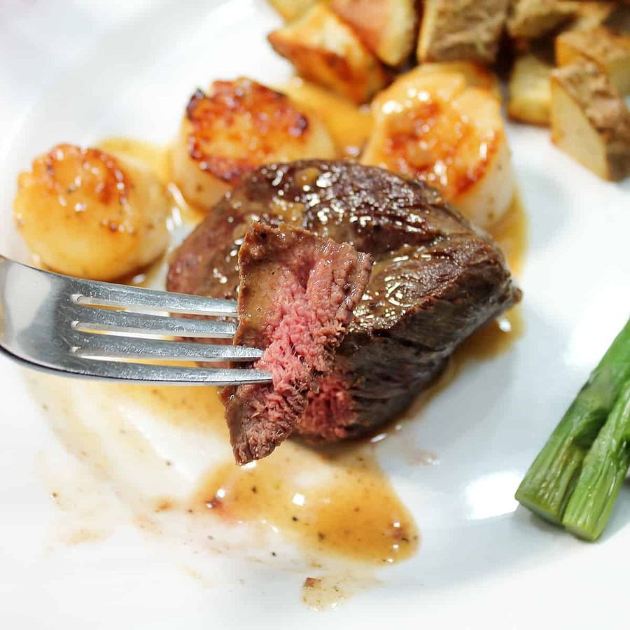 Collage of Ostrich Meat Dish, Quinoa Salad, and Durian Fruit
