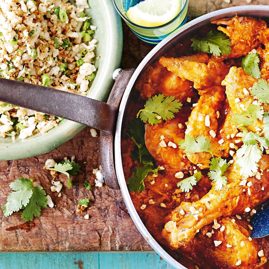 A delicious assortment of popular African dishes including Jollof rice, Bunny Chow, and Doro Watt