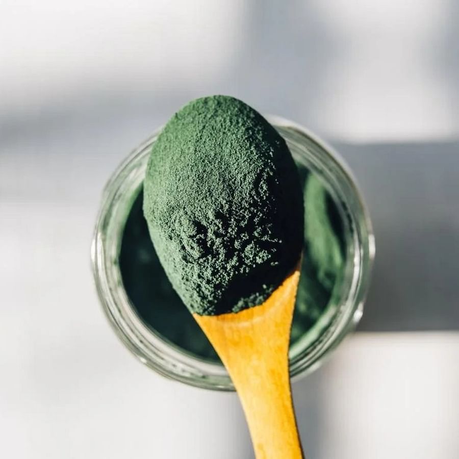 Close-up view of vibrant green spirulina powder
